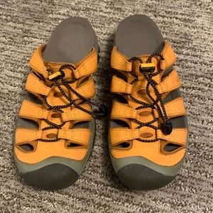 Orange keen slip ons